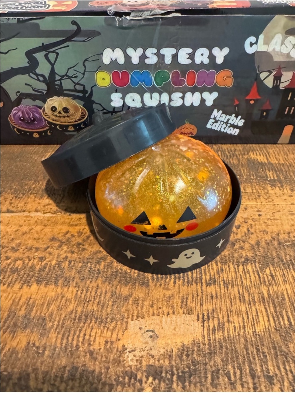 Halloween Pumpkin Dumpling Glitter Squishy w/ Storage Case - Orange Sensory Toy - Picture 2 of 8